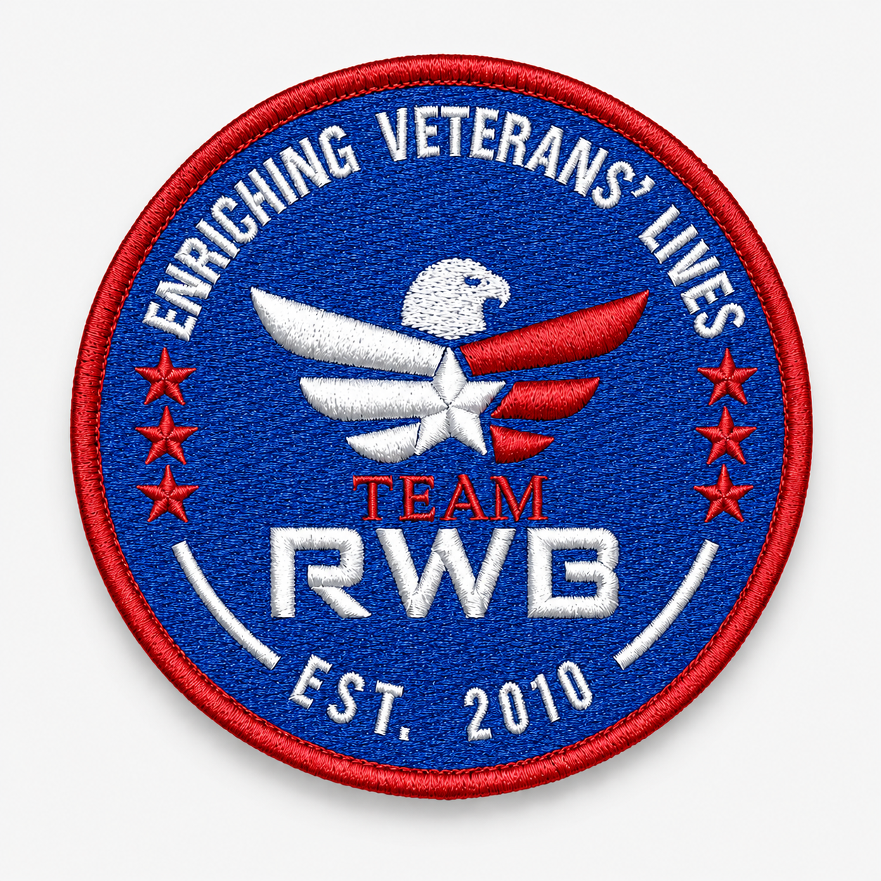 Embroidered patch with eagle design, text 'Enriching Veterans' Lives', and 'Team RWB' branding on a blue background.