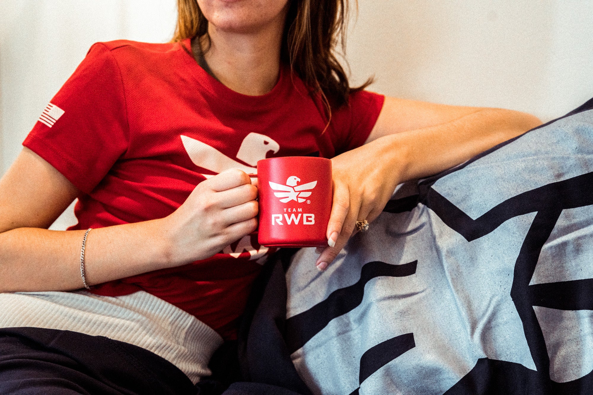 Team RWB member holding MiiR Camp Cup – red insulated coffee mug