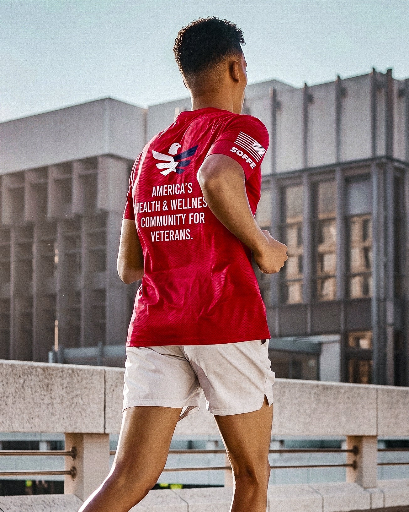 Team RWB Soffe Performance Mesh T-Shirt Red – lifestyle back view showing back graphic, male Eagle running