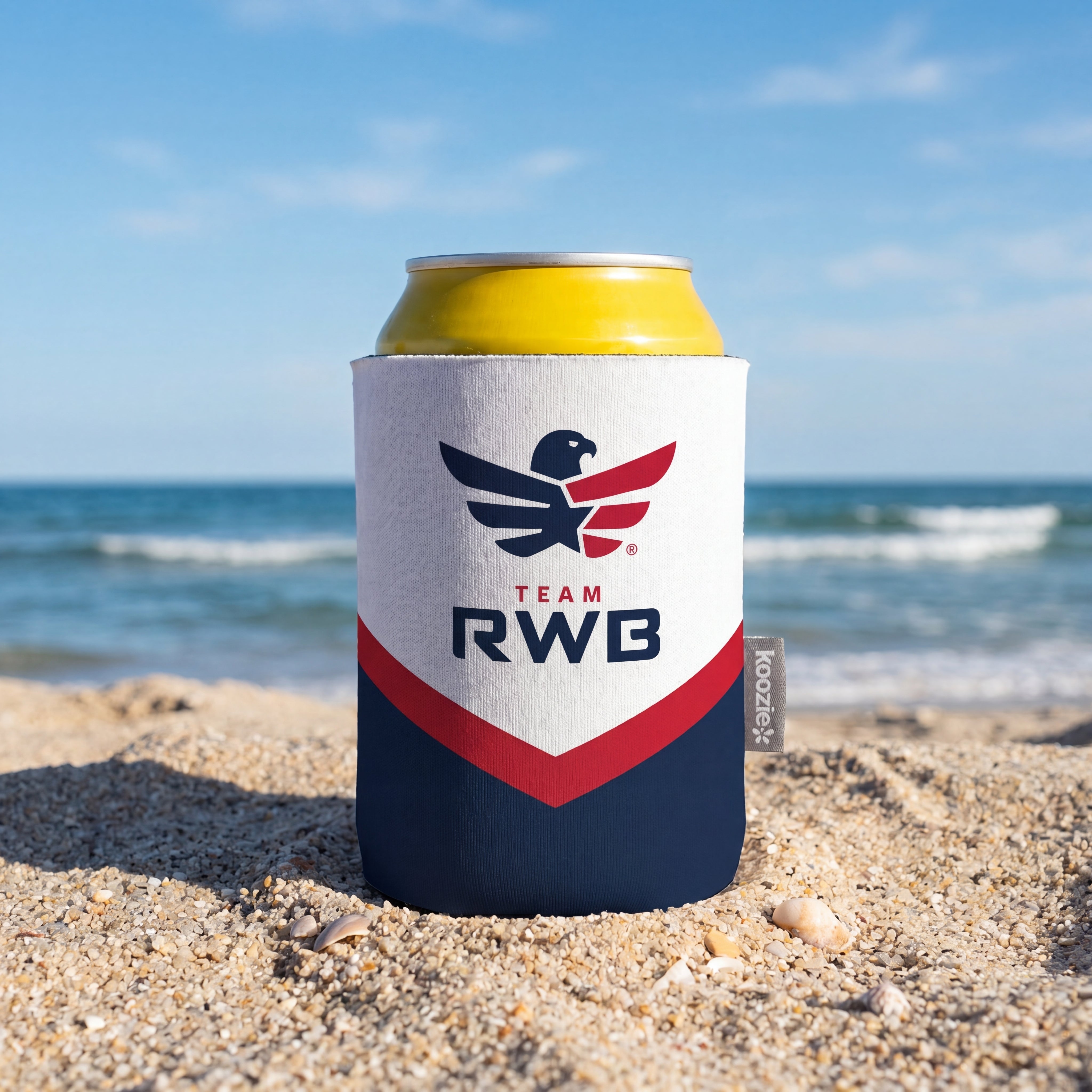 Can cooler with Team RWB logo on a beach