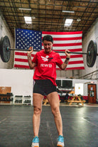 Woman training in Team RWB Women's Nike Dri-FIT T-Shirt – overhead barbell press
