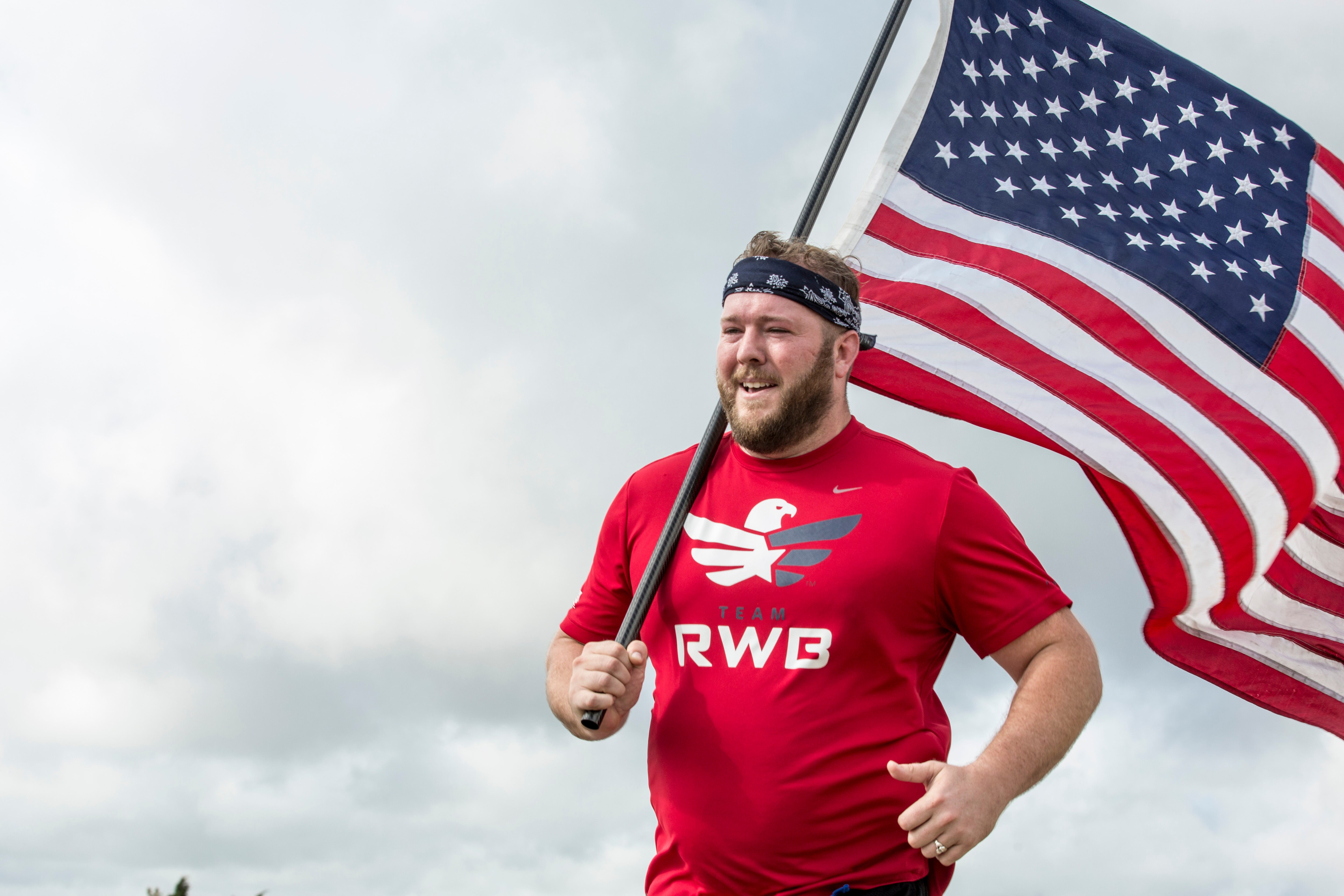 Man running with American flag in Team RWB Men's Nike Dri-FIT T-Shirt