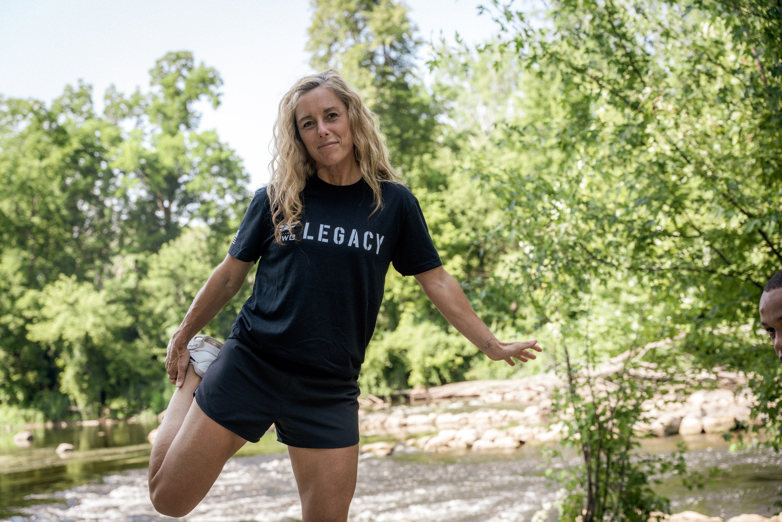 Team RWB member wearing Legacy anniversary shirt, lifestyle shot showing fit