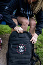 Team RWB Legacy GORUCK GR1 Rucksack detail view – close-up of embroidered Team RWB Eagle logo and 15th anniversary design on front panel.