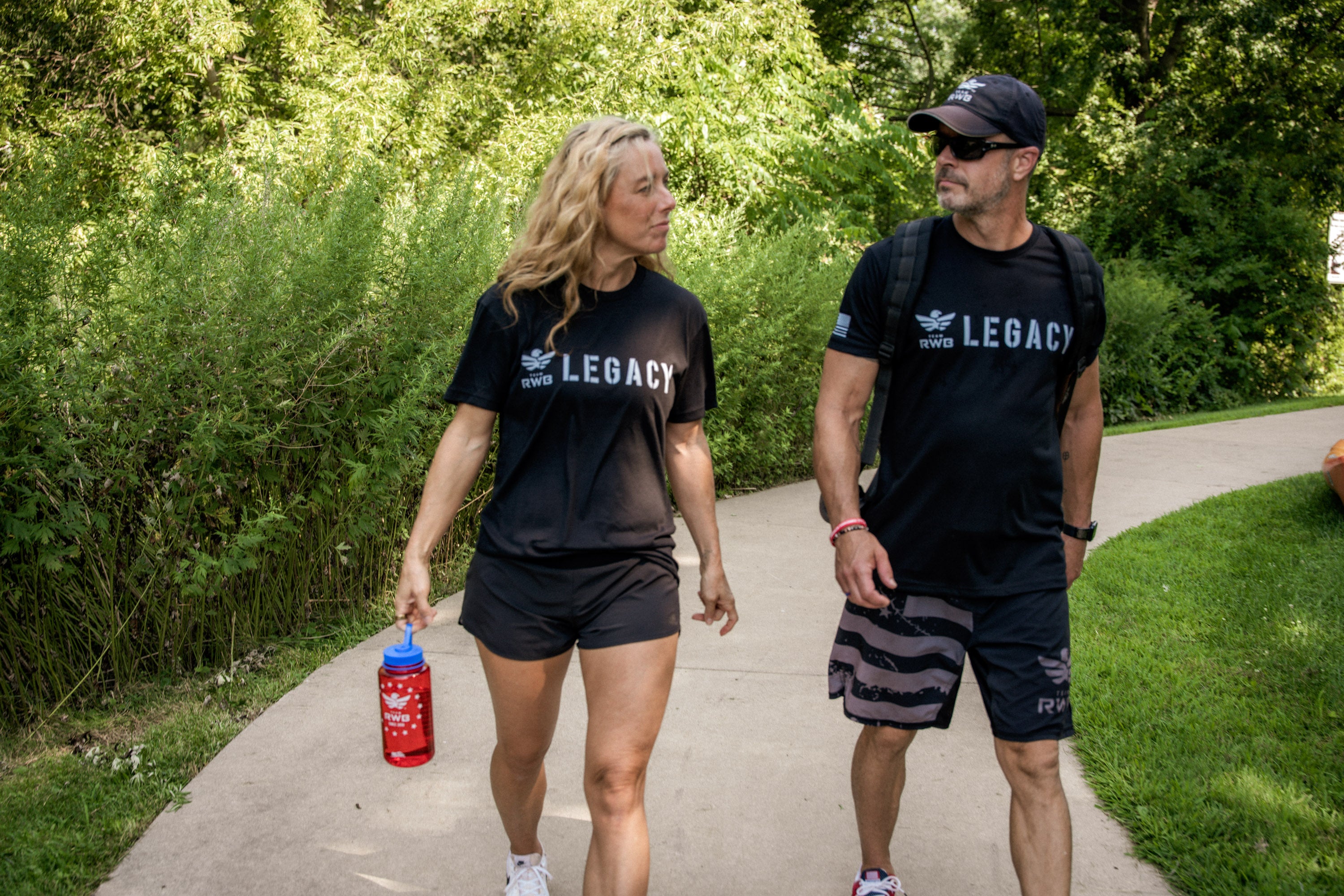 Team RWB members wearing Legacy anniversary shirt during a group outdoor activity