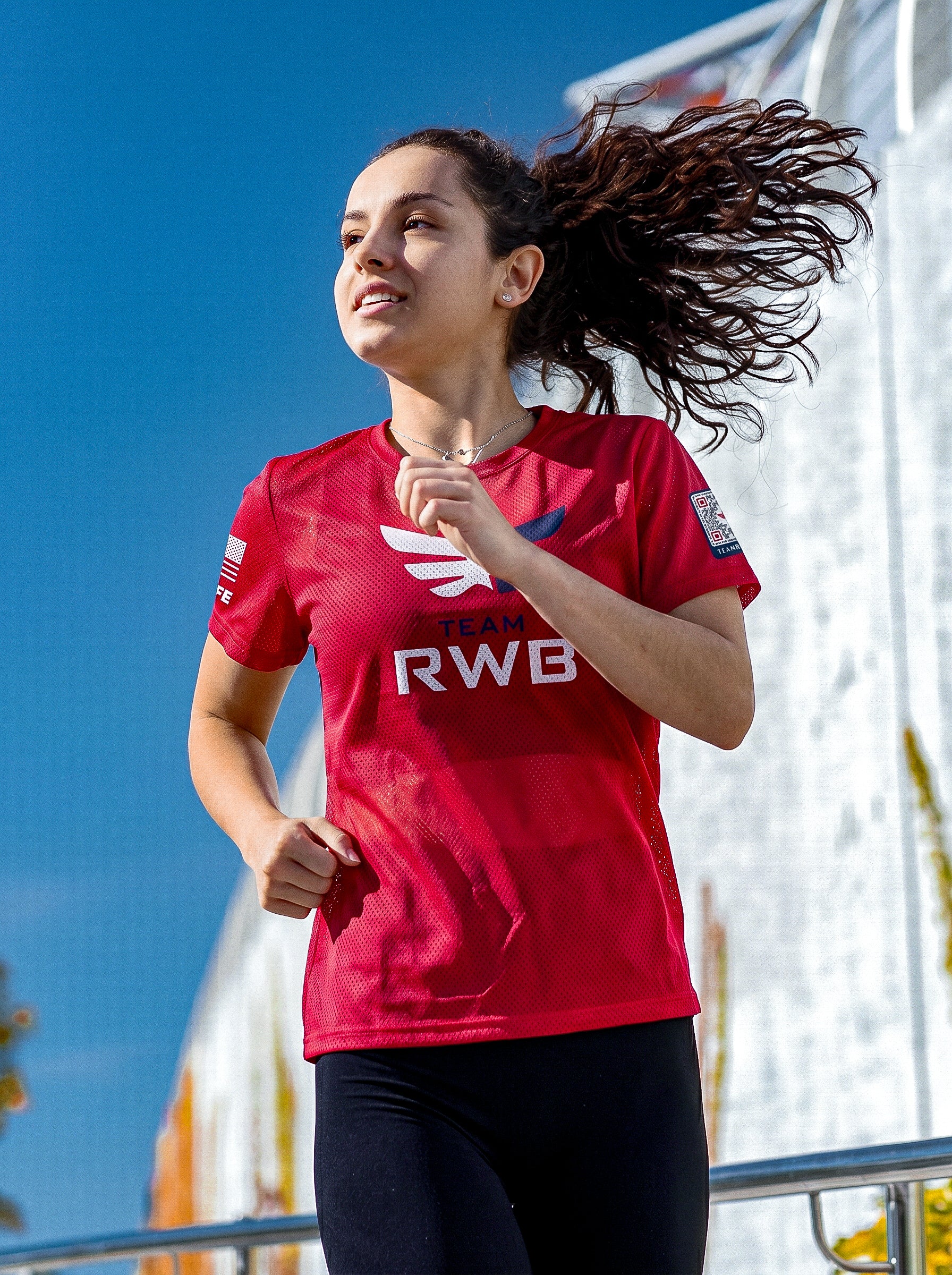Team RWB Soffe Performance Mesh T-Shirt Red – lifestyle front view, female Eagle running outdoors