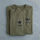 Folded green t-shirt with 'RWB' logo on a gray surface